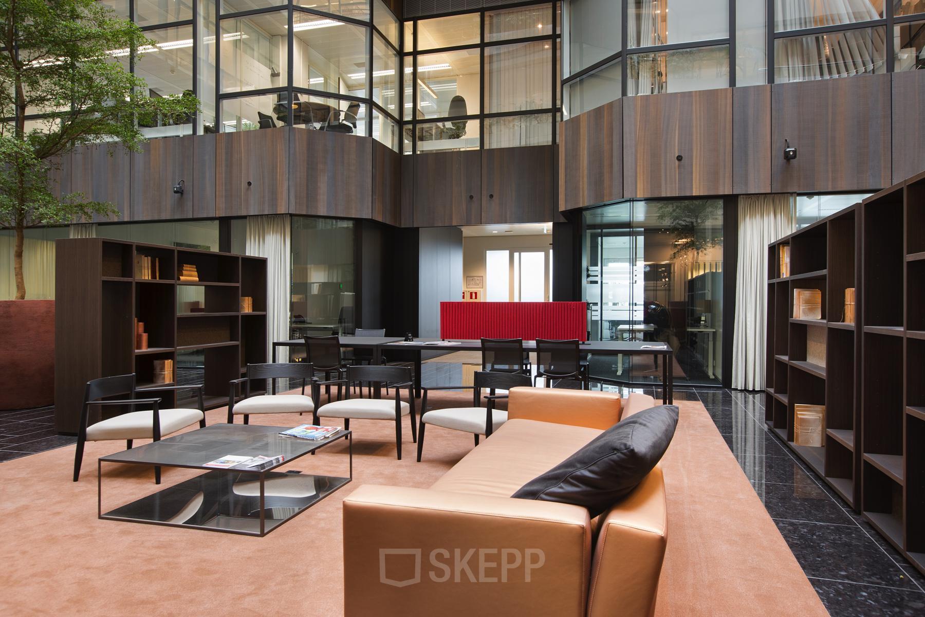 Elegant office space rental at Strawinskylaan 3051, Amsterdam Zuidas, with modern furnishings and a welcoming ambiance.