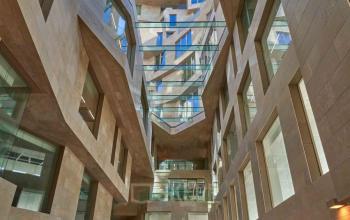 Stunning architecture of the office building at Beethovenstraat 503, Amsterdam Zuidas, showcasing a modern facade with geometric glass patterns. Ideal for office space rental, combining elegance and functionality.