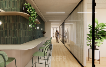 Modern office space at Beethovenstraat 503, Amsterdam Zuidas, featuring a sleek counter with bar stools, glass partitions, and vibrant plants, creating an inviting environment for office space rental. Professionals engaged in conversation.
