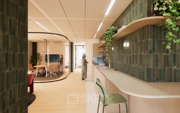 Bright and modern office interior at Beethovenstraat 503, Amsterdam Zuidas, showcasing a furnished workspace with plants and a workspace setup, perfect for office space rental needs.
