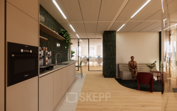 Modern lounge and pantry area in an office located at Beethovenstraat 503, Amsterdam Zuidas, featuring sleek seating, a coffee machine, and open access to workspaces beyond, ideal for office space rental.