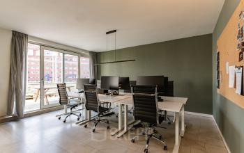 Modern furnished office space for rent with multiple workstations, overlooking Amsterdam Zuidas at De Boelelaan 1110.