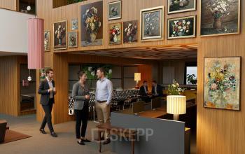 Modern office space in Amsterdam Zuidas, featuring stylish decor and people engaged in discussions, perfect for office space rental needs.