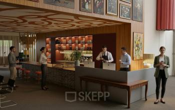 Spacious office to rent at Barbara Strozzilaan 101 101, Amsterdam Zuidas, featuring a stylish coffee bar with professionals engaged in discussions and work activities.