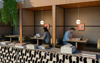 Cozy office spaces at Barbara Strozzilaan 101 101, Amsterdam Zuidas, with individuals working on laptops, ideal for office space rental.