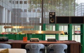 Modern office space at Barbara Strozzilaan 101, Amsterdam Zuidas featuring stylish furnishings with large windows overlooking urban scenery. Ideal for office space rental.