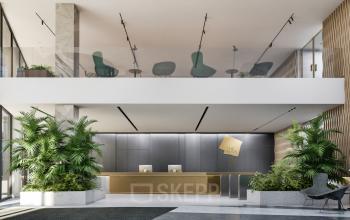 Modern reception area at Claude Debussylaan 80-134, Amsterdam Zuidas, perfect for office space rental with stylish furnishings and lush greenery.