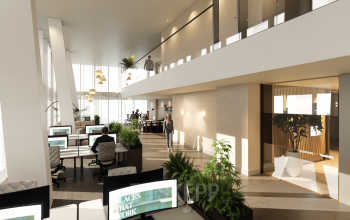 Modern office space rental at Claude Debussylaan 80-134, Amsterdam Zuidas, featuring workstations with people engaged in business activities in a well-lit, furnished interior.