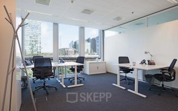 Modern office space rental with large windows and natural light at Gustav Mahlerplein 2, Amsterdam Zuidas.