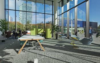 Bright and modern office to rent at Gustav Mahlerplein 2 in Amsterdam Zuidas, featuring large floor-to-ceiling windows, contemporary furnishings, and city views.