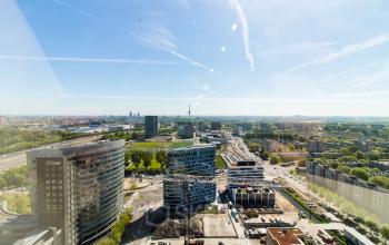 Aerial view of office buildings at Gustav Mahlerplein 109-115 in Amsterdam Zuidas with surrounding cityscape.
