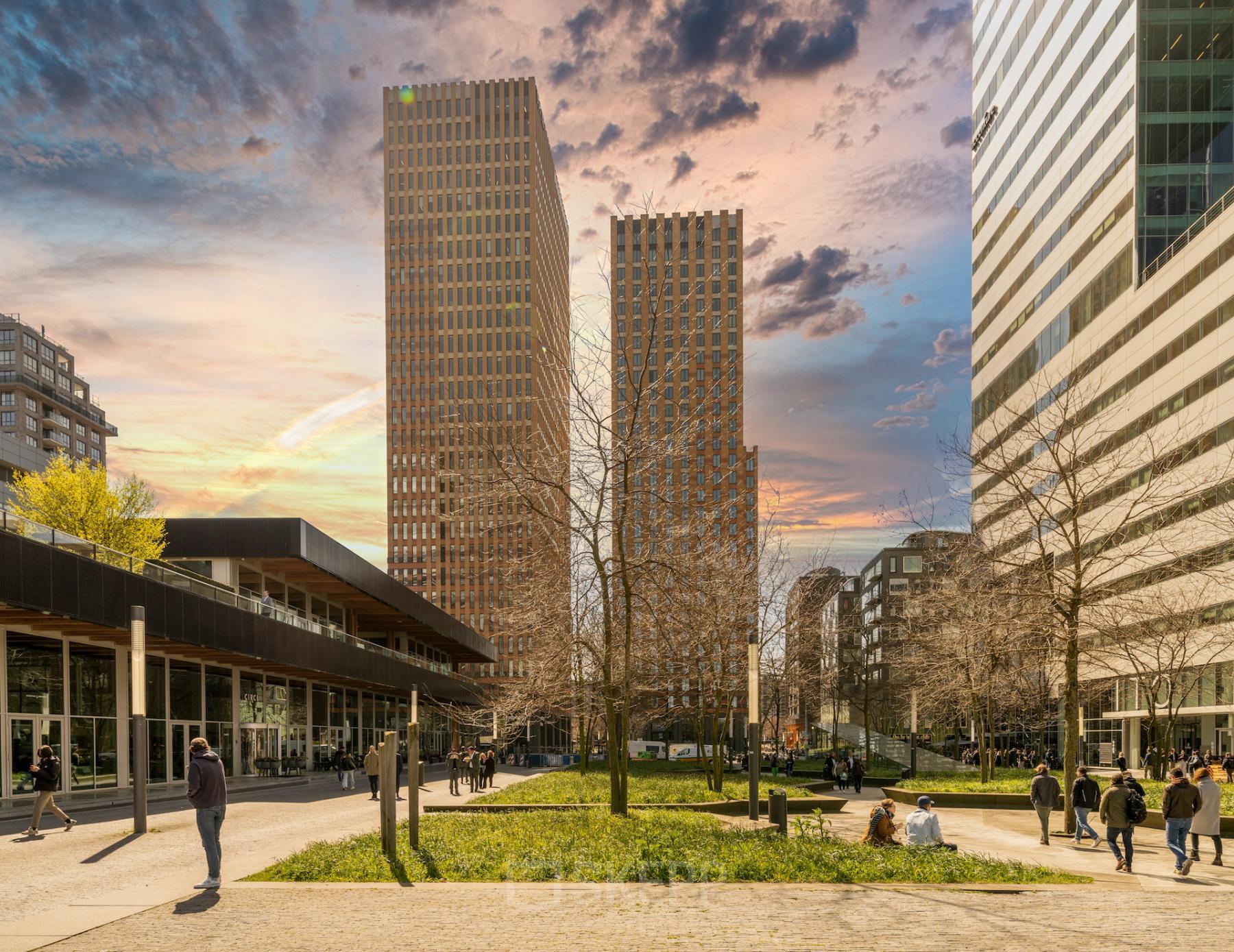 Exterior view of the office building located at Gustav Mahlerplein 109-115, Amsterdam Zuidas, showing tall structures with a plaza and people walking.