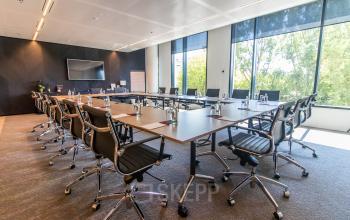Spacious conference room at Gustav Mahlerlaan 1212, Amsterdam Zuidas, with large windows and modern furnishings, ideal for businesses seeking office space rental.