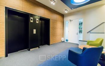 Modern office building with elevators and manned reception