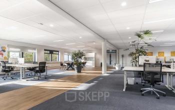 Spacious interior office space at Waterloseweg 7a, Apeldoorn, featuring modern desks, comfortable chairs, and abundant natural light, perfect for businesses looking for office space rental in a professional setting.