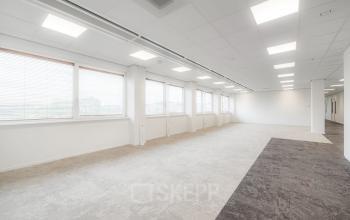 Spacious, unfurnished office interior with bright natural light available for office space rental at Laan van Malkenschoten 40, Apeldoorn, Apeldoorn.
