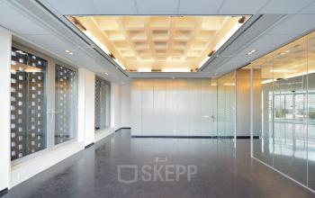 Modern, spacious office to rent located at Laan van Malkenschoten 40 in Apeldoorn, featuring ample natural light and sleek design.