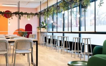 Modern office space rental at Jansbuitensingel 30, Arnhem Centrum, featuring stylish furnishings and vibrant colors.