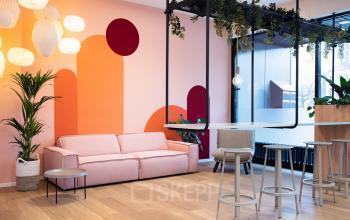Modern office space rental at Jansbuitensingel 30 in Arnhem Centrum with comfortable furnishings and vibrant decor.