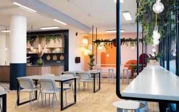 Modern office space rental at Jansbuitensingel 30, Arnhem Centrum, featuring stylish furniture and vibrant decor.