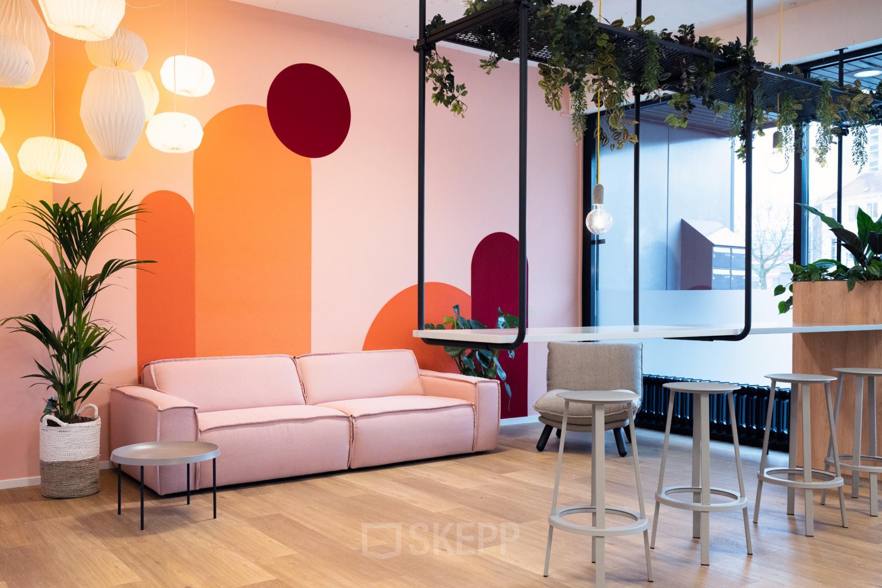 Modern office space rental at Jansbuitensingel 30 in Arnhem Centrum with comfortable furnishings and vibrant decor.
