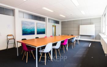 Multiple office spaces present for different group sizes