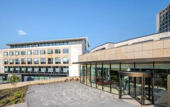 Exterior view of the office building at Rijksweg-West 2, Arnhem Zuid, Arnhem, featuring modern architecture with large windows and a clean, landscaped pathway.