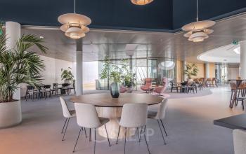 Modern office lounge area at Rijksweg-West 2, Arnhem Zuid, Arnhem with stylish furniture and plants, available for office space rental.