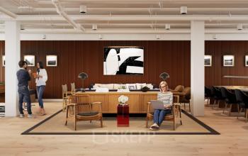 Modernes Büro in der Rosenthaler Straße 43-45 in Berlin Mitte mit Mitarbeitern bei Geschäftsgesprächen, eine Person arbeitet am Laptop, perfekte Bürofläche mieten.