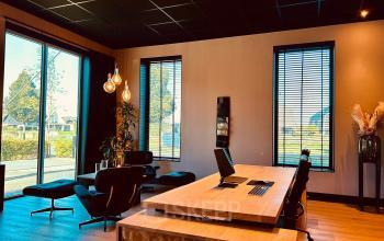 Sleek office space at Deltazijde 20b in Blaricum featuring modern furnishings with large windows providing ample natural light, perfect for office to rent enthusiasts seeking a productive workspace.
