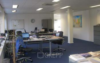 Spacious office with desks, chairs, and cabinets at Zomerzorgerlaan 50 in Bloemendaal, suitable for office space rental.