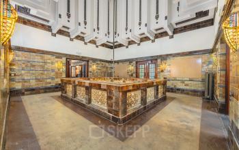 Spacious, ornate interior featuring intricate tiled walls and a central architectural element, ideal for an office space rental at Ceresstraat 13, Breda Centrum-Station.