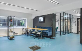 Interior view of a furnished office space rental at Ceresstraat 13, Breda Centrum-Station featuring modern seating and a meeting area.