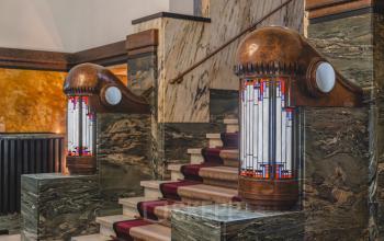 Interior view of an office at Ceresstraat 13, featuring a stylish stairway with decorative lighting, ideal for office space rental.