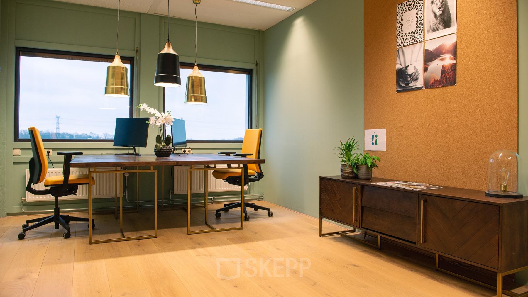 Office space rental in Heerbaan 14, Breda Oost-Brabantpark, featuring stylish workstations with ample natural light, elegant lighting fixtures, and green plants enhancing the modern environment.