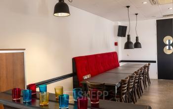 Interior of office space at Druivenstraat 25-31, Breda Oost, with a long table and chairs, ideal for meetings or collaborative work.