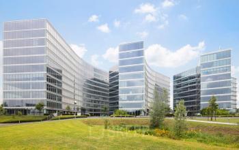 Exterior of large, modern office buildings at Leonardo Da Vincilaan 1, Brussels Airport, available for office space rental.