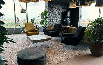 Stylish and modern lounge area at Leonardo Da Vincilaan 19, Brussels Airport, Brussels with cozy seating and large windows offering a view.