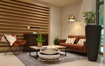 Cozy lounge area with modern furniture and decor in an office for rent at Leonardo Da Vincilaan 19, Brussels Airport.