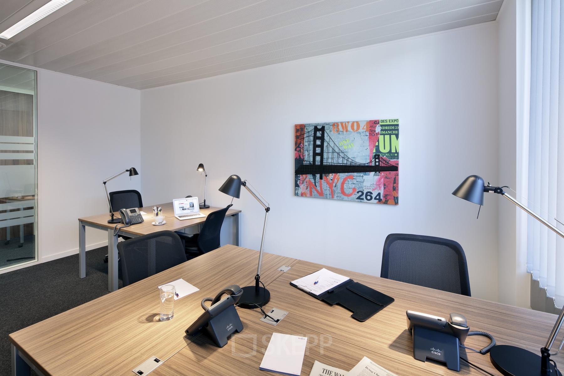 Bright, furnished office space rental at Place Marcel Broodthaers 8, Brussels South, featuring modern desks and chairs with sleek lighting and decor.