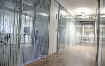Modern office space rental at Kanaalweg 33 Capelle aan den IJssel with glass walls and contemporary design.