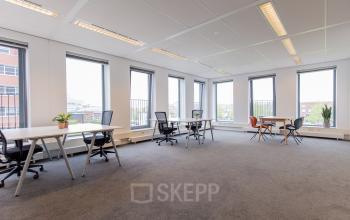 Bright office space with large windows and modern furnishings available for rent at Fascinatio Boulevard 562, Capelle aan den IJssel.