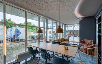 Modern office space at Rhijnspoor 209-263, Capelle aan den IJssel with stylish furnishings and large windows offering plenty of natural light, ideal for rent office space inquiries.