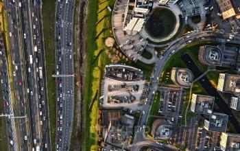 Aerial view of Rivium Quadrant 75, Capelle aan den IJssel, showcasing surrounding office buildings and roadways, ideal for office space rental.