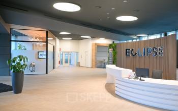 Modern reception area in an office space rental at Rivium Quadrant 75, Capelle aan den IJssel, with sleek design, bright lighting, and welcoming atmosphere.