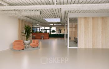 Modern office interior at Essebaan 63-69, Capelle aan den IJssel, featuring open floorplan with stylish seating area and conference room. Ideal for office space rental with contemporary design elements.