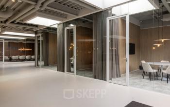 Spacious and modern office space at Essebaan 63, Capelle aan den IJssel, featuring glass walls and a conference room, ideal for office space rental.