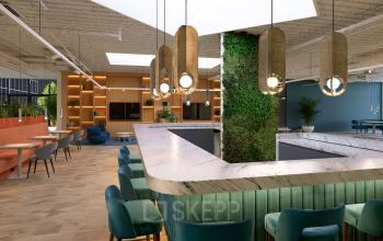 Modern office space rental at Essebaan 63-69, Capelle aan den IJssel features stylish furnishings, vibrant seating, and natural light creating an inviting, productive environment.