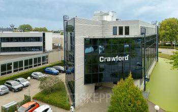 Exterior view of an office building at Vlierbaan 20, Capelle aan den IJssel, suitable for office space rental with ample parking available.