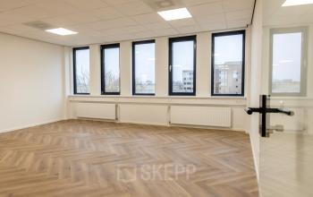 Spacious unfurnished office space with large windows at Vlierbaan 20, Capelle aan den IJssel, available for rent. Ideal for customizing your office to rent needs.